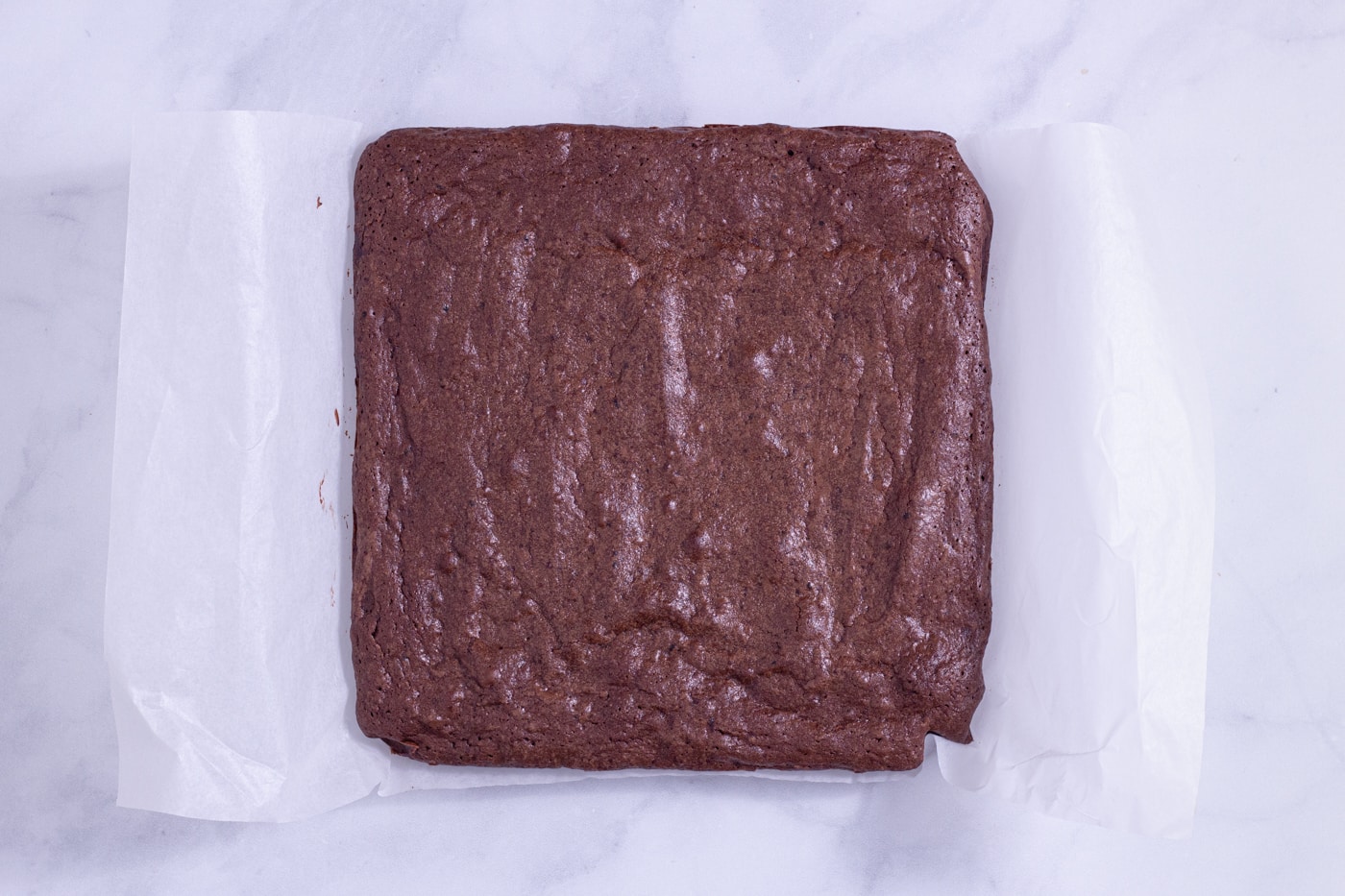 Overhead view of a square block of brownies made with reduced red wine.