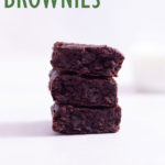 Straight on view of a stack of dairy free, gluten free brownies on a white background.
