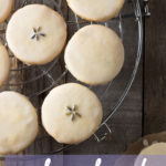 Overhead, close up view of Lemon Lavender Shortbread Cookies on a cooling rack on a wood surface.
