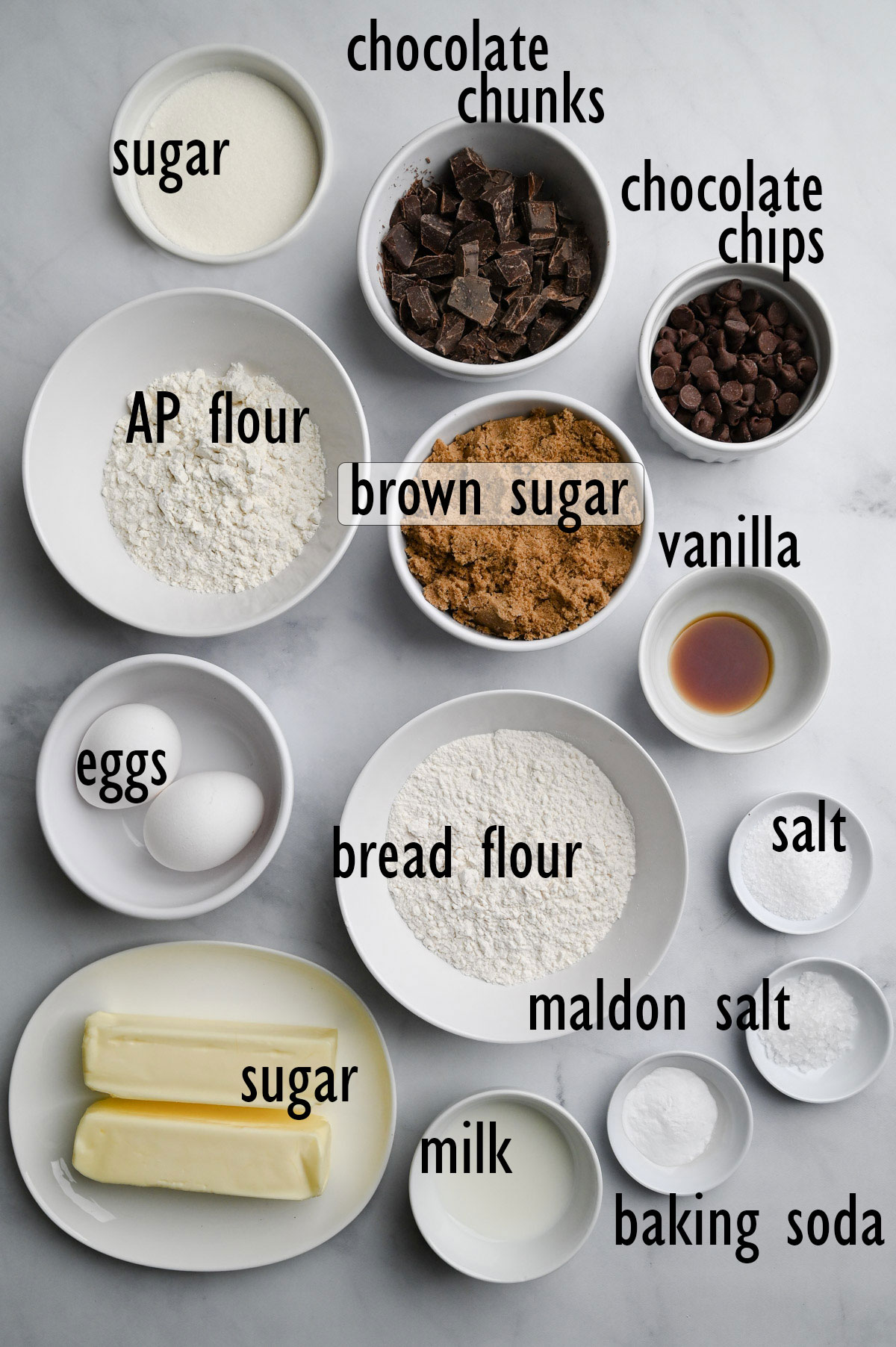 Cookie ingredients including flour, sugar, brown sugar, butter, chocolate, eggs, salt, vanilla and baking soda.