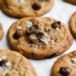 Close up angled view of salted, brown butter chocolate chip cookies.