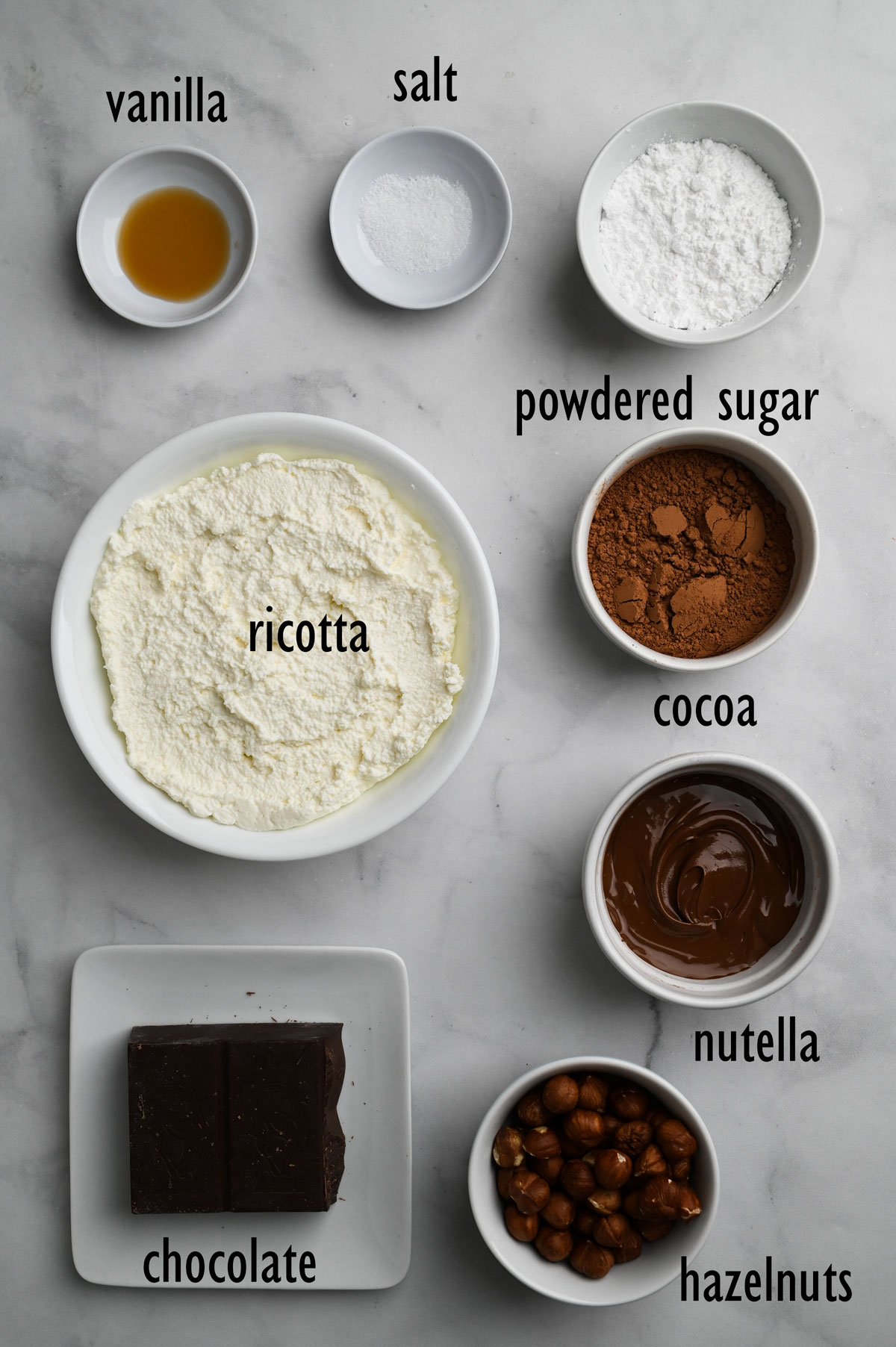Cannoli filling ingredients Including ricotta, cocoa, Nutella and powdered sugar.