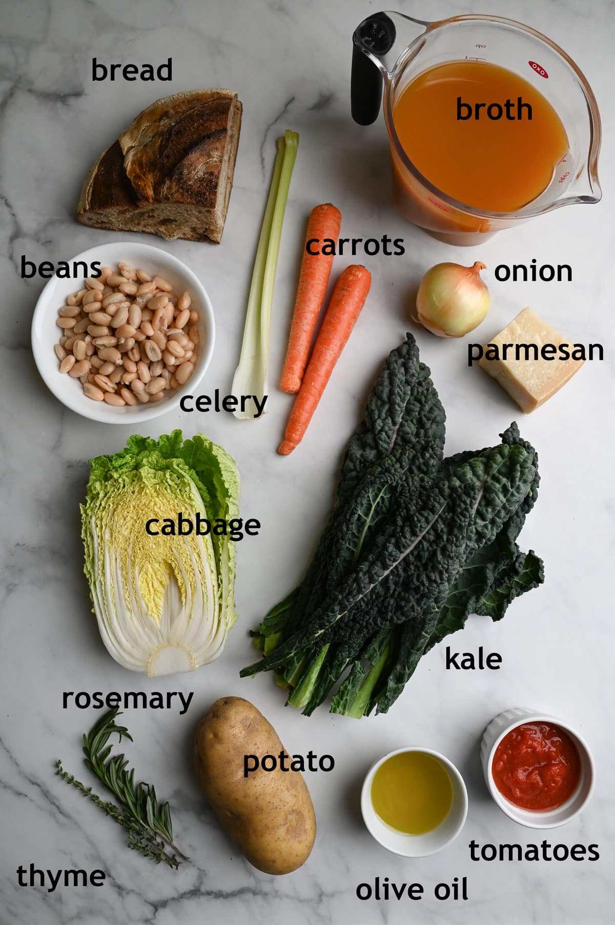 Vegetarian Tuscan Bread Soup Ingredients including kale, white beans, cabbage, carrots, celery, onion, broth and bread.